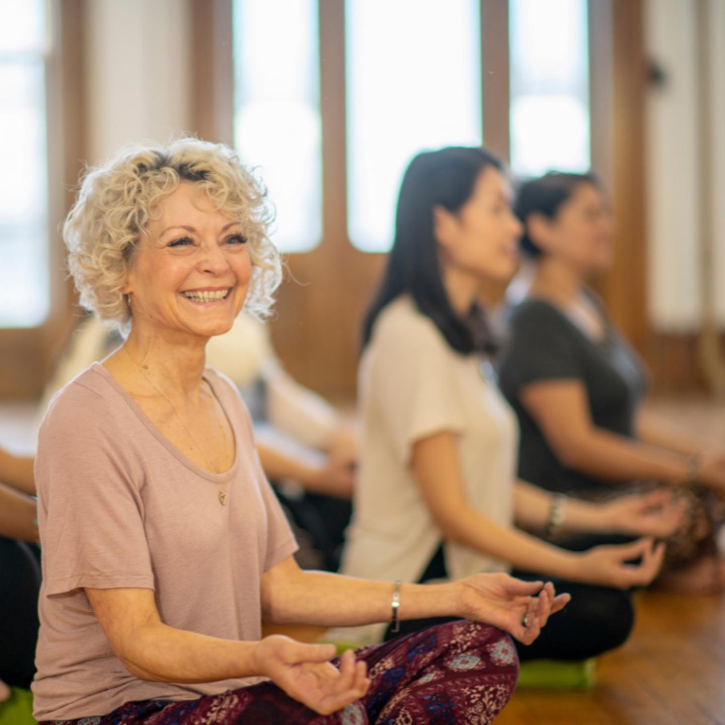 Photo of smiling people in a yoga class