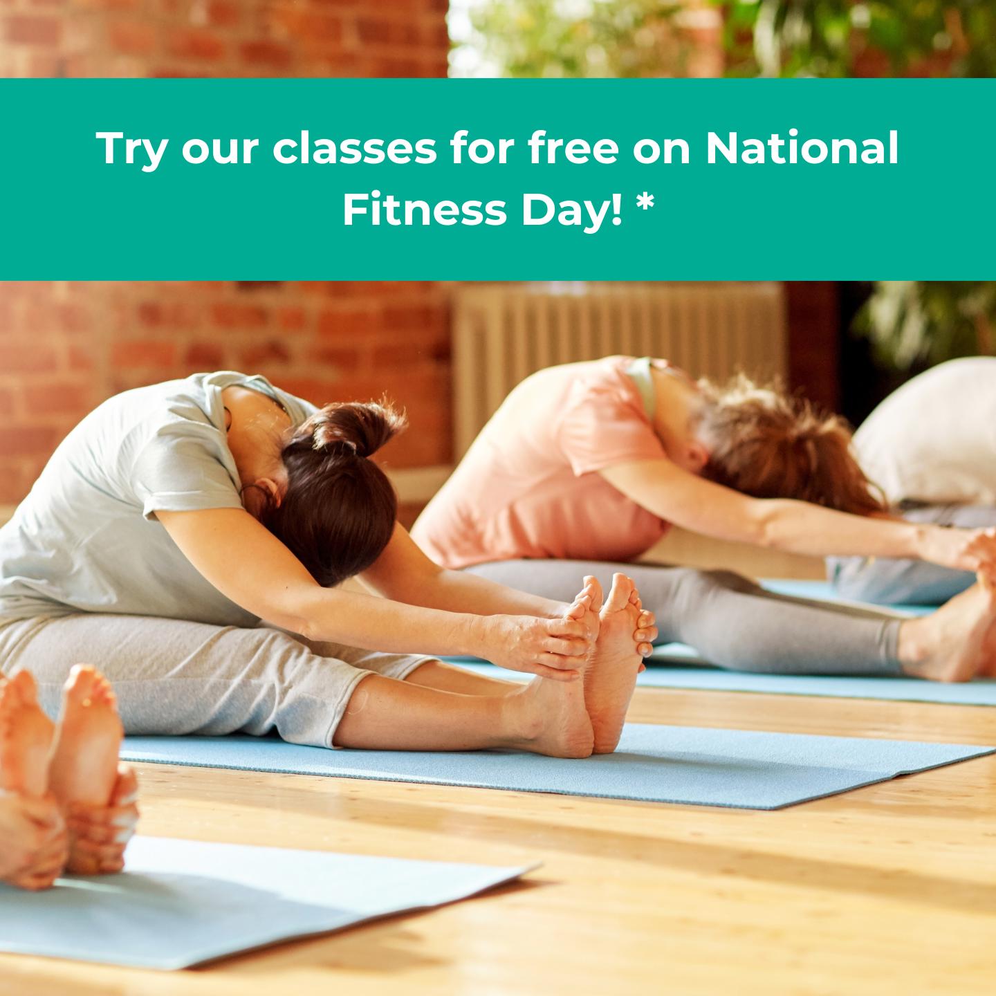 Photo of people stretching on mats in a group fitness class