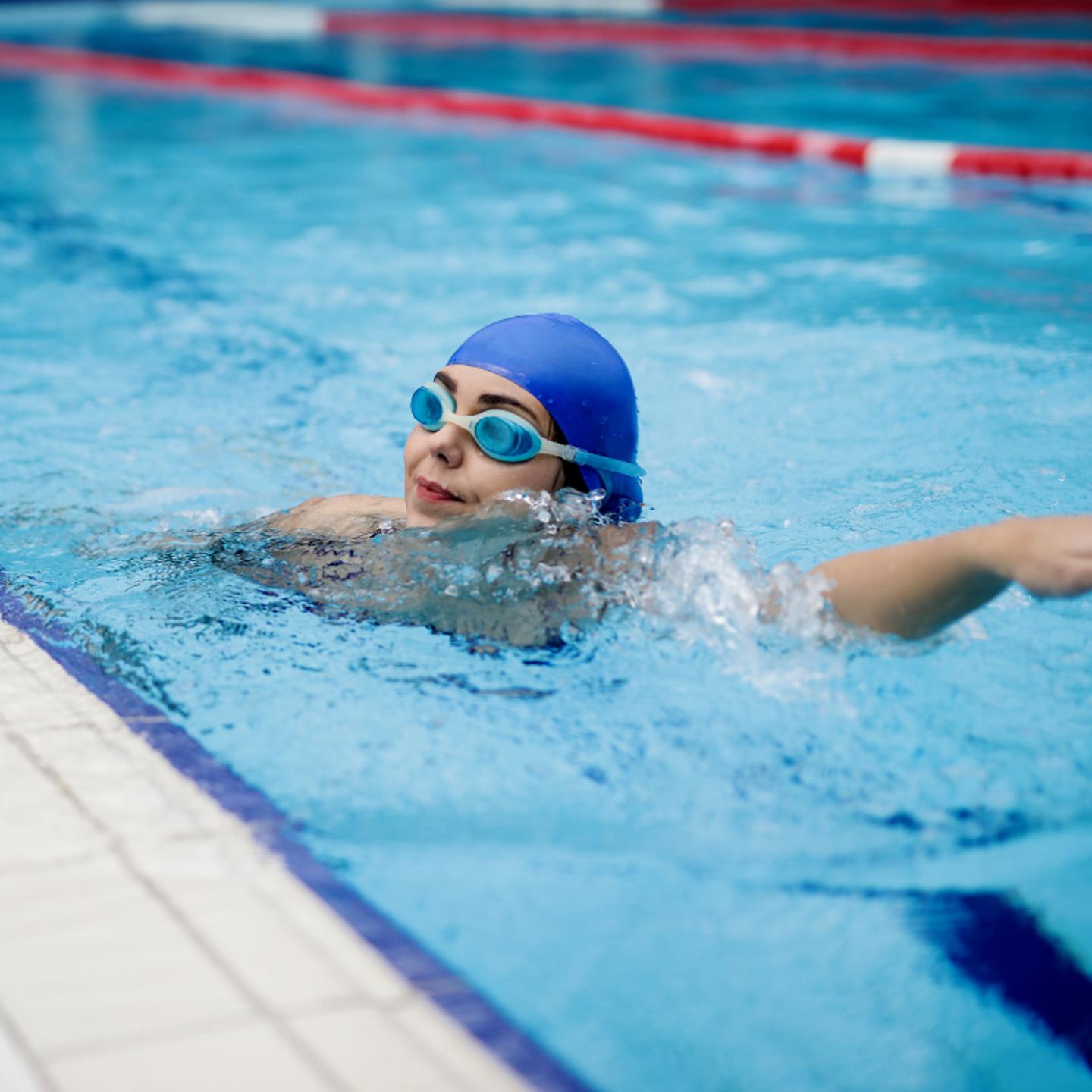 Person lane swimming in swimming pool