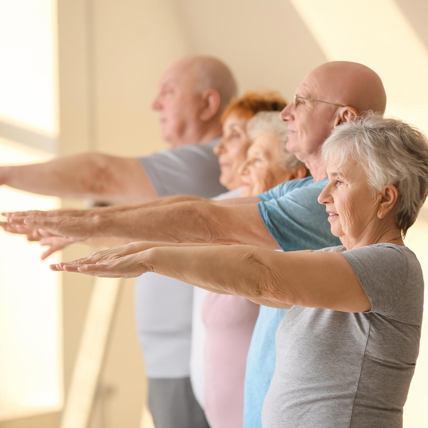 Photo of older people in a class stretching