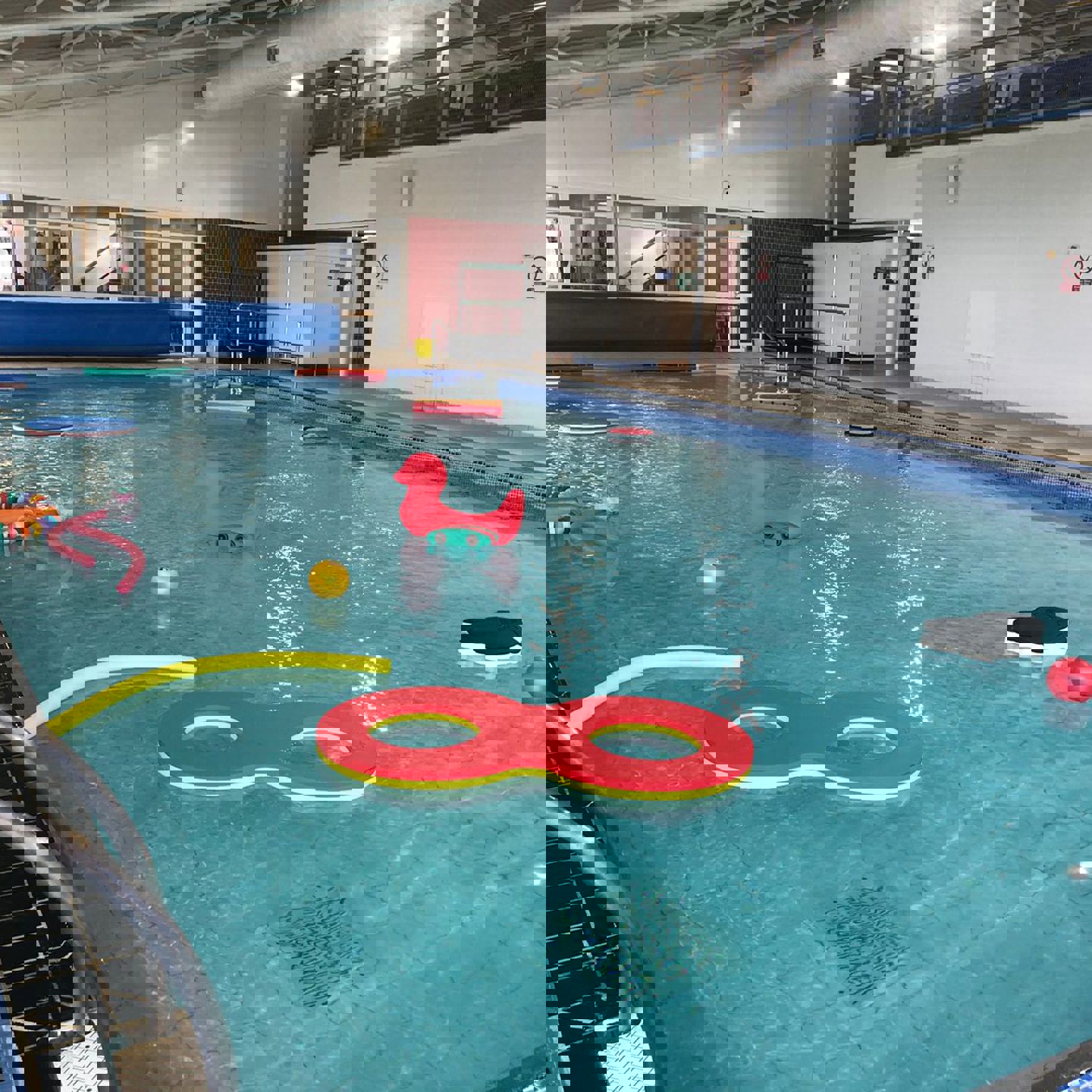Photo of Les Quennevais Small Pool with toys and small floats in it for Pool Playtime