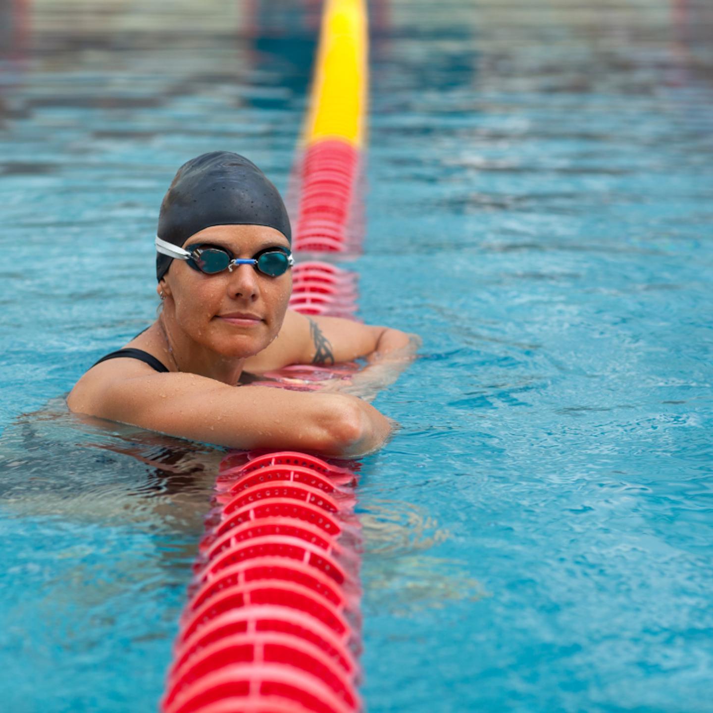 Person lane swimming in swimming pool