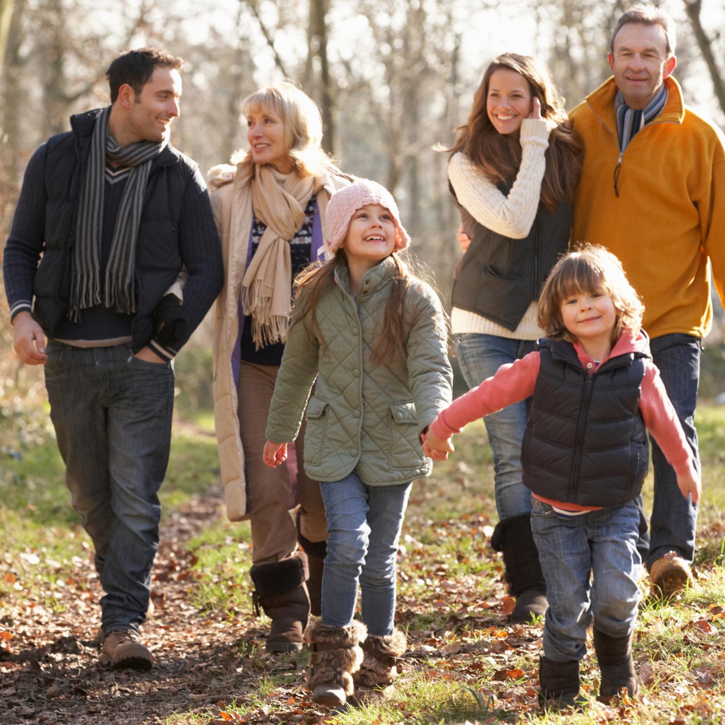 Photo of a family taking an Autumn walk